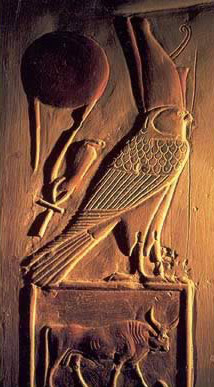 A crowned version of Horus as a Falcon. Below is the sign of Taurus, and you can see to the left is a Cross. At the top right you can see a large red ball, which may be a reference to Nibiru. - Armageddon Broadcast Network